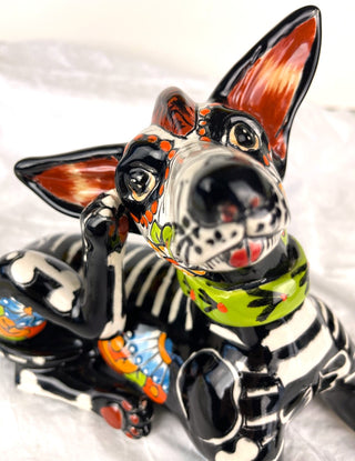 This big eyed, bone cat has been beautifully hand painted.&nbsp; She's just calmly contemplating life before tearing up the house! She sports a cute little fish collar, whiskers and a little red tongue. She would love to sit on your desk to keep you company. Makes a great pet!