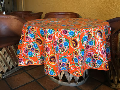 Round Oilcloth Tablecloth – Floral on Orange